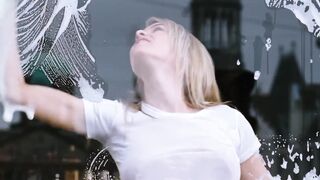 Katie Downes' wet T-shirt on glass (xpost from r/Celebs)