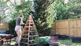 Holly Wolf gardening in booty shorts