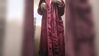 Girl takes off the bathrobe