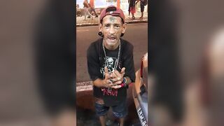 [NSFW] Man showcasing hits nuts in a public street