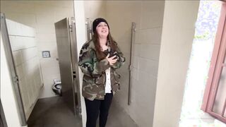 Showing off her tits and ass in a public bathroom