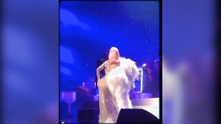Playing with her ass on stage