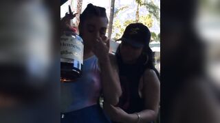 Swigging a bottle of Hennessy while your friend plays with your tits.