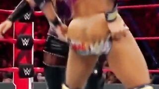 Sasha Banks having her pants pulled down.
