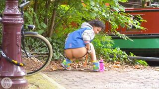 Arianna peeing by the canal