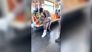 Breast feeding a man in diapers on a train.
