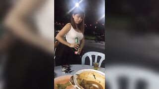 She opens a beer with her boob