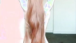 Letting her long, copper-red hair fall onto her bare back; then making waves. (xpost r/hairplay)
