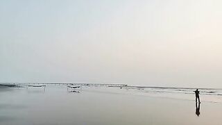 Sunset on the longest sea beach in the world at Cox's Bazar