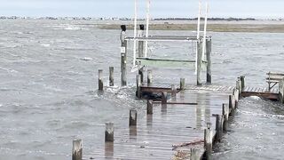This is the Barnegat bay in NJ. Normally dangling toes in at high tide. This is day 5 of gale force winds and flooding. Already tore the end of the dock off
