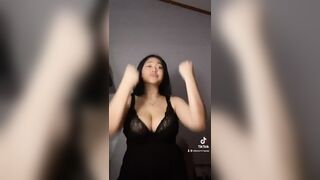 Big tits asian in black